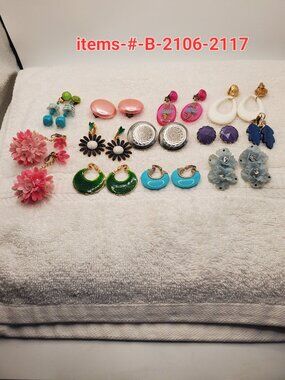 12 Pair of clip on earrings, items # B-2106-2117,. wt. 123 grams.